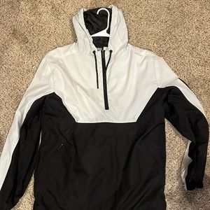 White on black rain coat